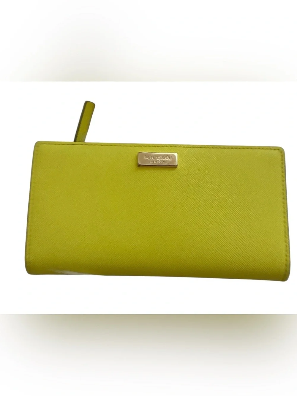 Lime green Kate Spade New York slim bifold wallet features multiple card slots